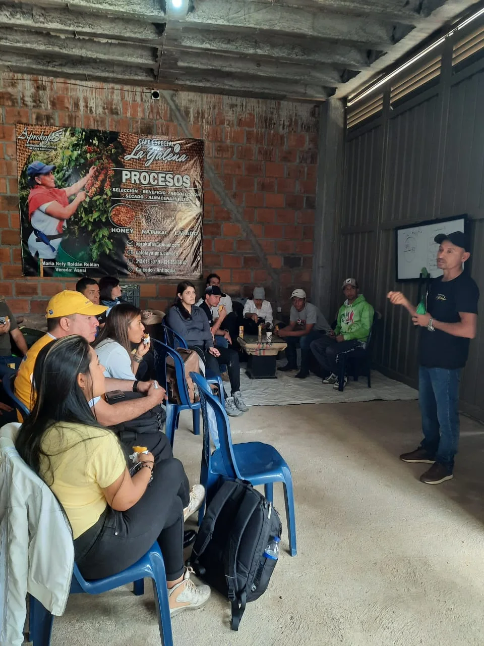 Edwin speaking with coffee producers